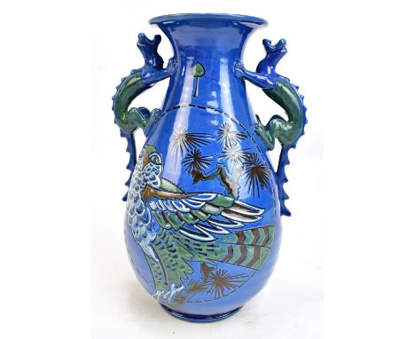 CH BRANNAM; a twin handled art pottery vase with tubeline decoration of mythical birds, with applied dragon handles, impresse