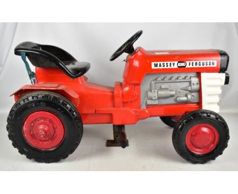 A vintage child's fairground ride modelled as a Massey Ferguson 1080 tractor with red and black painted fibreglass body, and 