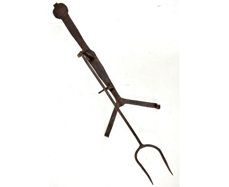 A 19th century wrought iron toaster or griller with twin pronged fork, length 62cm.Additional InformationSurface pitting, cor