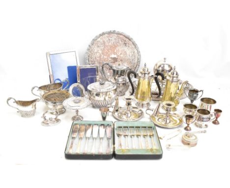 A quantity of assorted silver plate to include photograph frames, gadrooned tea service, trays, etc.Additional InformationDen