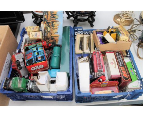 Two baskets containing quantity of boxed and unboxed die cast vehicles including a Dinky fire engine, Lledo promotional model