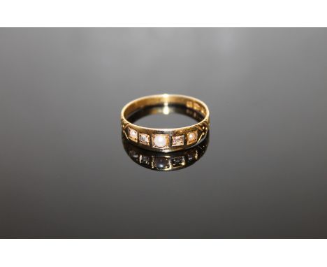 An 18ct gold pearl and diamond ring, size P, 2.3g.