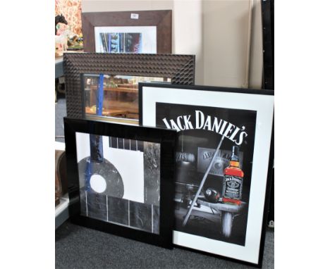 A contemporary framed mirror together with a New York Times Square print, a Jack Daniels print and one other