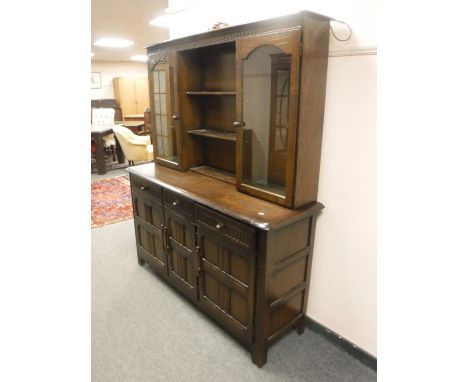 An Ercol oak kitchen dresser, width 153 cm 
