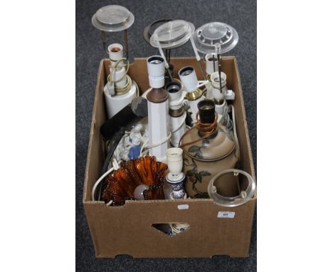 A box containing a quantity of china table lamps together with a glass pendant light fitting and a picture light