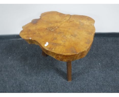 A tree trunk cross-section coffee table CONDITION REPORT: The top measures 56cm by 62cm and the height is 49cm. 