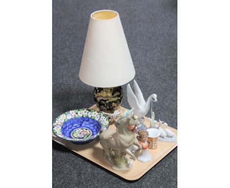 A tray containing Maling bowl, Royal Winton table lamp with shade, two Nao figures, a Royal Albert Jermima Puddleduck figure 