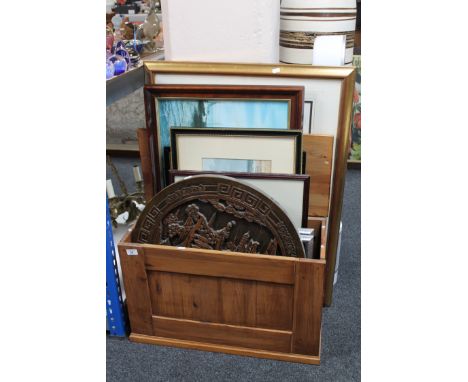 A pine box of assorted framed pictures and prints including a Heath Robinson print, carved circular Eastern panel etc 