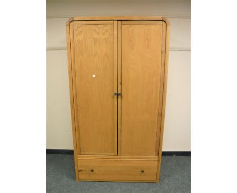 A Barker &amp; Stonehouse light oak wardrobe fitted with a drawer, width 100 cm 