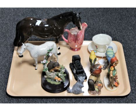 A tray containing a Royal Doulton grey horse, Maling lustre jug, Goebel figure of a girl seated on a fence, Goebel bird etc