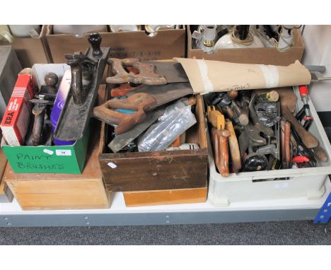 Four boxes and a crate of assorted hand tools, saws, paintbrushes, woodworking planes etc