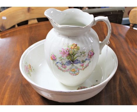 A floral pottery wash jug and basin