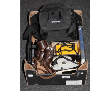 A box containing Mamiya camera bag with ZE camera and lens, Kodak camera, leather cased camera and a video maker's handbook 