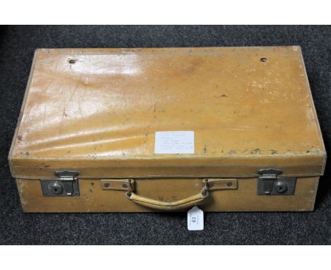 A vintage pig skin leather suitcase