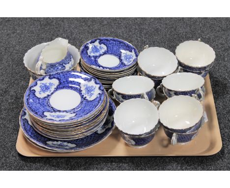 A tray containing a thirty-nine piece antique English blue and white china tea service