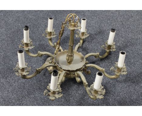 A continental gilt metal eight way light fitting 