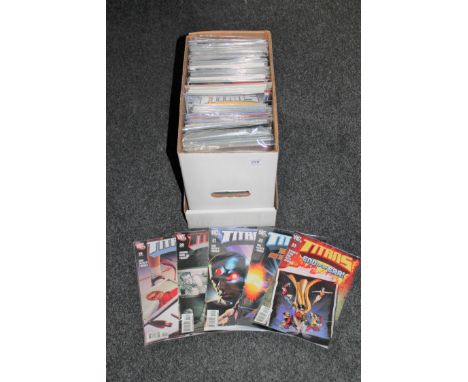 A box containing 21st century comics including Green Arrow, Batman, New Avengers etc