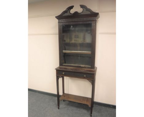 An antique Chippendale style mahogany cabinet on stand fitted with a drawer, width 77 cm. 