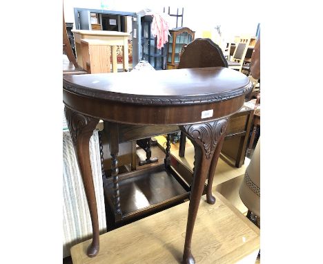 A demi-lune console table with cabriole legs, height 74cm.  