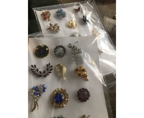 4 bags vintage and modern brooches  