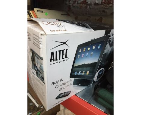 An Altec Lansing speaker and charging dock for IPad  