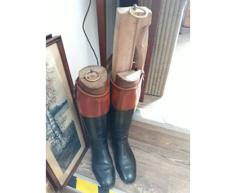 A pair of vintage leather riding boots with wooden trees.Condition: no signs of major damage, no tears to leather, discoloura