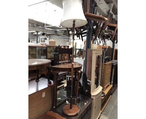 A retro teak and brass standard lamp.  