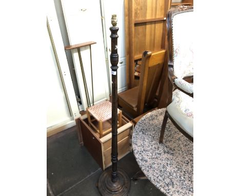 A stained beech lamp standard.  