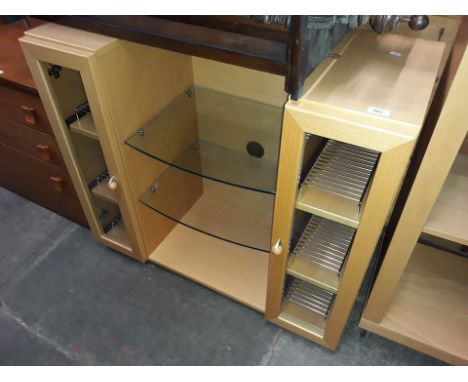 A modern light wood and glass HiFi cabinet.  