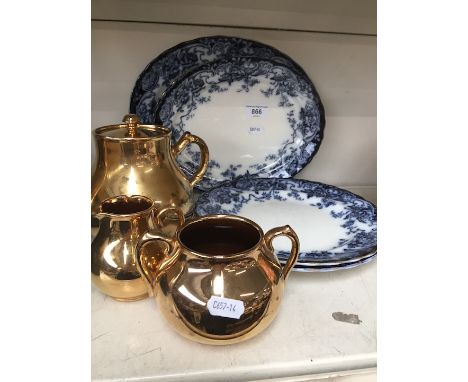 Some plates and gold coloured teaware  