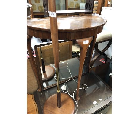 A walnut demi-lune console table.  