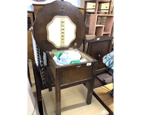 A Morco vintage oak lift top sewing box table.  