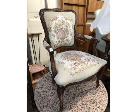 A French style armchair with tapestry upholstery.  