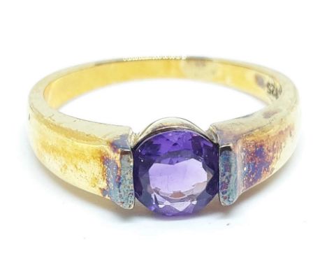 A silver gilt solitaire ring set with an amethyst coloured stone, marked '925', size U, with box.  