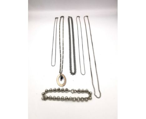 A collection of silver chains of varying length and a white metal rollerball link bracelet. Longest 56cm 49g 