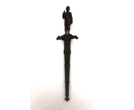 A 19th century French colonial bronze handled dagger with relief design bronze scabbard. The sculpted handle in the form of a