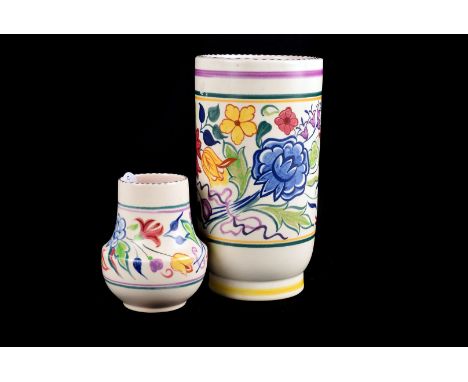 A Poole pottery vase,  the Art Deco cylindrical vase with central band of flowers against a white ground, printed mark to bas