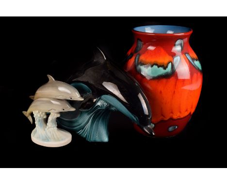 A Poole pottery modern vase,  of ovoid shape, also in the lot three graduated Poole pottery dolphins, and a Gobel pottery exa