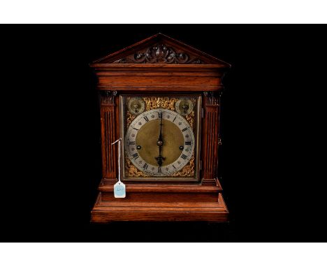 A large oak bracket clock, by Morath Bros, Liverpool,8 day movement, striking on five gongs with silvered chapter ring and as