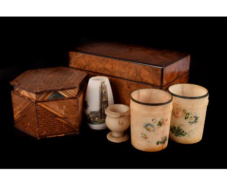 A collection of Victorian and later boxes and works of art, including a walnut tea caddy, a pair of alabaster beakers and egg