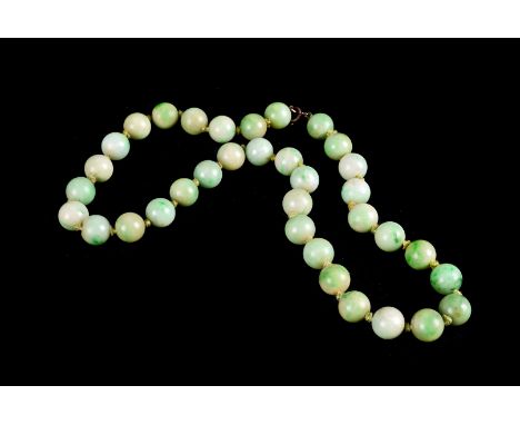 A green jade bead choker, each bead approx. 1cm dia. 