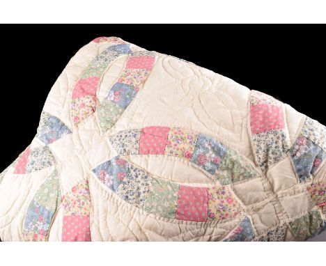 Two American style patch work quilts, of decorative geometrical design,213cm x 213cm  with cream back and borders  and  colou