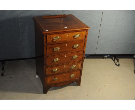 A George III period mahogany bachelor's chest of drawers, the narrow form having five drawers with inlaid designs, AFsome lig