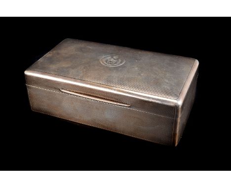 A George V silver cigarette box, with engraved panel to engine turned lid with China and a dragon, the inner with inscription