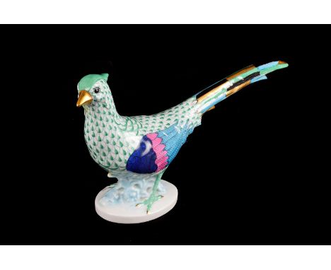 A Herend porcelain Pheasant , with green fish scale markings to neck and chest, blue, pink and turquoise wings, blue, green, 