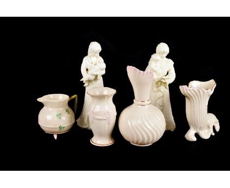A group of Belleek porcelain, including eight Belleek items with shamrock jug, cornucopia jug, three vases and two bowls, tog