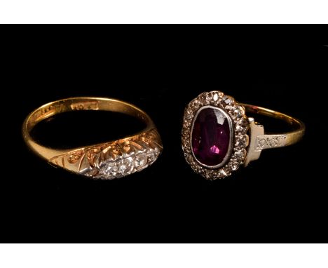 An 18ct gold graduated five stone diamond ring, together with a garnet and diamond cluster ring 5g (2)