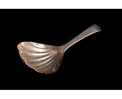 A George III silver caddy spoon by John West, London 1803, with scallop shell bowl and brightcut engraved handle ?ozt.the hal