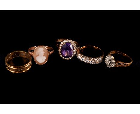 Five vintage and modern 9ct gold and gem set rings, including one Alexandrite style cluster, one eternity, a cameo ring, a se