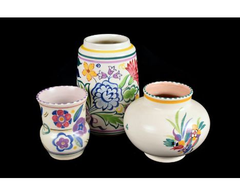 Three pieces of 1950s Poole pottery, the three different shaped vases with various designs (3)